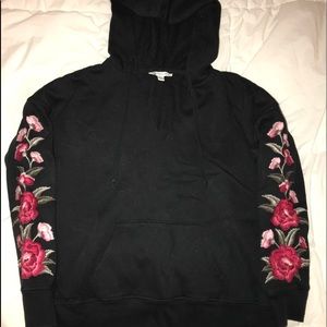 American Eagle black hoodie with roses on sleeves